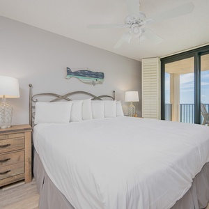 Relax in the spacious master suite featuring a plush king bed and beachfront balcony access