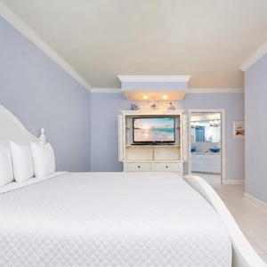 Stream your favorite shows or enjoy a good movie before drifting off to sleep in this elegant master suite