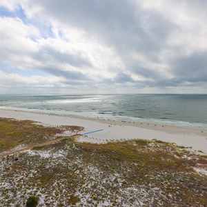 Relax with the tranquil beachfront, inviting guests to enjoy the serene coastal atmosphere