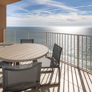 Recline on a sun chair or sit at the patio table while sunlight shimmers across the gulf