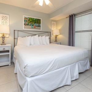 Cozy master bedroom featuring a plush king bed, stylish decor, and soft lighting for a relaxing retreat