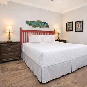 Drift into restful nights in the king suite, surrounded by cozy decor and charming coastal vibes