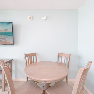 Enjoy meals at the round table while soaking in the beach views from the balcony