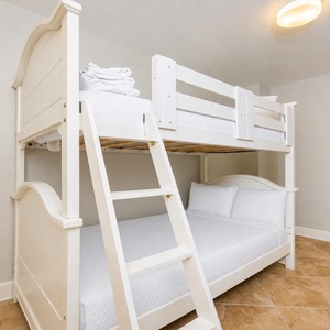 Experience cozy nights in this charming twin bunk room, where playful adventures await after beach-filled days