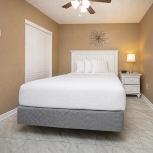 Drift into peaceful sleep on a plush queen bed in the guest room, embraced by soothing hues and warm light