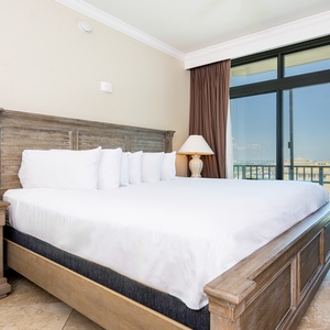 Sink into the queen bed in this guest room while soaking in stunning views of the coast from the balcony