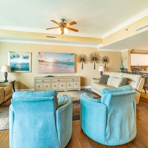 Two comfy recliners and sofas invite you to unwind while watching your favorite shows
