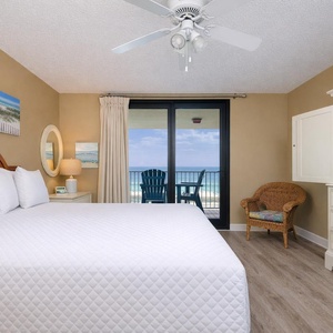 Drift into relaxation on your plush king bed, soaking in coastal views and the tranquil vibe of your private retreat