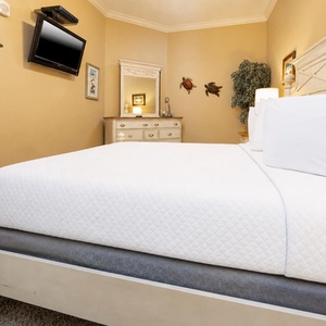 Experience restful nights in a soft, inviting king bed in this guest suite, perfect for recharging after beach adventures