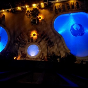 Experience serene evenings by the illuminated pools, where you can unwind with family under a starlit sky