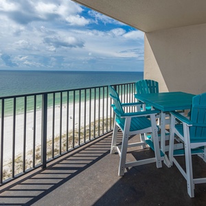 Savor meals or drinks at the outdoor table while taking in the breathtaking views of the beach and water