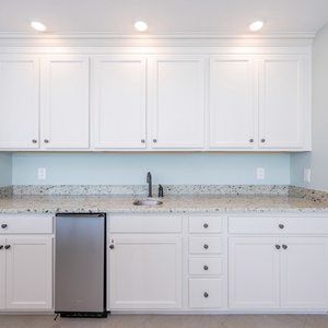 Enjoy refreshing drinks prepared at the convenient wet bar, perfect for unwinding after a day along the coast