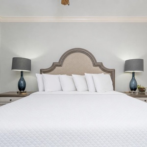 Plush pillows and gentle lighting create a calm retreat for restful nights in this guest suite