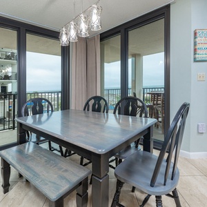 Gather around the dining table to share laughter and create lasting memories while soaking in the beach vibe