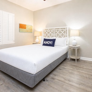 Rest comfortably in this inviting guest bedroom, where a queen bed awaits you after a day of beach adventures