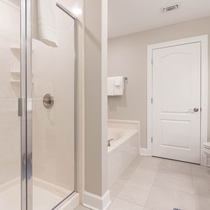 Indulge in relaxation in the master bath with a refreshing walk-in shower and soothing tub