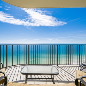 Breathe in the fresh coastal air on your balcony while enjoying stunning beach views in this serene retreat