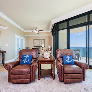 Sink into the cozy recliner and enjoy the warm beach vibes flowing through the expansive windows