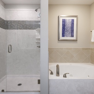 Indulge in relaxation in the master bath with a refreshing walk-in shower and soothing jetted tub