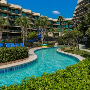 Float around in the lazy river at Phoenix on the Bay surrounded by palm trees for a refreshing getaway experience