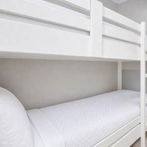 Bunk beds in the hallway offer a cozy spot for the kids after fun-filled days along the coast