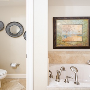 Refresh in the master bath after a day at the beach with a soothing jetted tub and relaxing walk-in shower