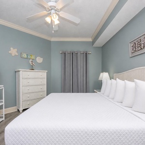 Drift into relaxation in this serene master bedroom, where soft king bedding invites restful nights