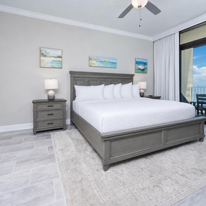 Unwind in the master bedroom with a cozy king bed, stylish decor, and direct access to breathtaking beach views