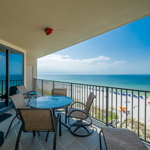 Enjoy expansive views of the tranquil waters and beach below while listening to the sounds of the coast