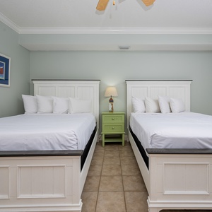 Relax on one of the cozy queen beds in this guest suite and enjoy a peaceful slumber