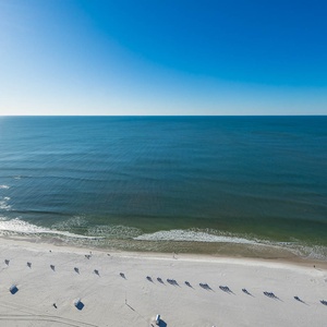 Watch the coastline stretch into the distance and the horizon meet the sky from your balcony while you soak up the sun