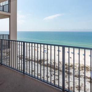 Enjoy the fresh air on the balcony while taking in sweeping views of the inviting shoreline and tranquil waters