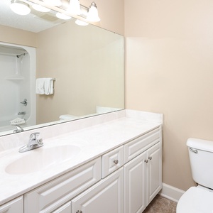 Indulge in a relaxing retreat in this guest bath, where mornings come with convenience and comfort