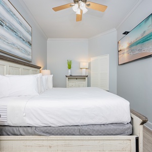 Relax on the cozy king bed in this guest suite and stream your favorite shows after a beach day