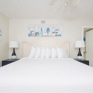 Drift into restful nights in this king guest suite, embracing the serene vibe and soft linens of your tranquil retreat