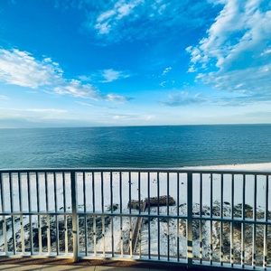 On the balcony, relish salty gulf breezes as the shoreline and horizon spread before you