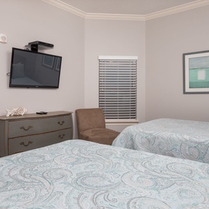 Unwind in this queen guest suite and stream your favorite shows or enjoy a good movie after a beach day