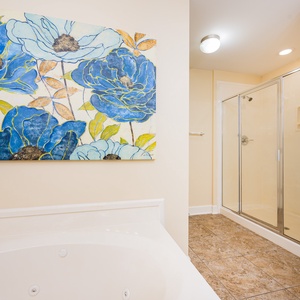 Relax in the refreshing shower in the master bath, surrounded by tranquil decor, creating a peaceful retreat
