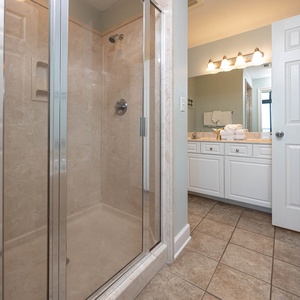 Indulge in relaxation in the master bath with a refreshing walk-in shower and soothing jetted tub