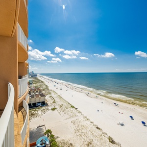 Enjoy breathtaking views from the balcony, overlooking the shoreline and inviting waters, perfect for relaxation