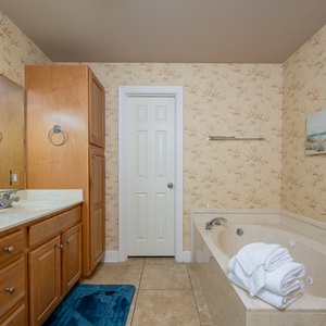 Indulge in a relaxing soak in the jetted tub in the master that enhances your coastal beach getaway