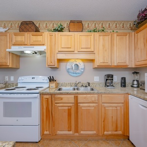 Prepare meals easily in the spacious kitchen with granite countertops and seating at the bar for casual dining