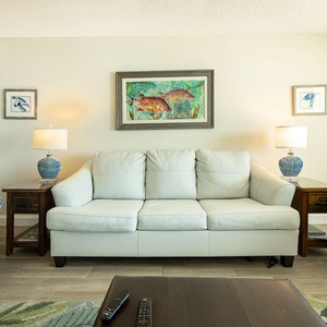 Soft armchairs surround your sofa with a  queen sleeper where you relax watching your favorite show in the living room