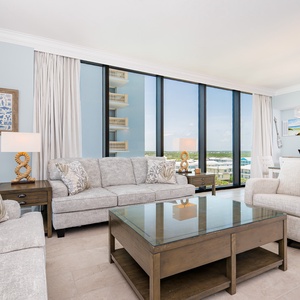 Cozy living space with plush seating and large windows that offer refreshing views