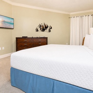 In the king master suite, you unwind while streaming favorite shows in peaceful comfort after your beach day