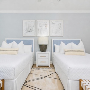 Relax in this guest room featuring two queen beds and stylish decor, for a restful stay