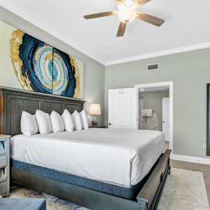 Take in the vibrant artwork in the king master suite that complements the coastal vibe