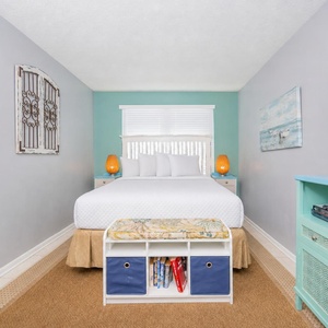 Cozy master bedroom featuring a queen bed, soft lighting, and a TV, perfect for relaxation after a day of adventure