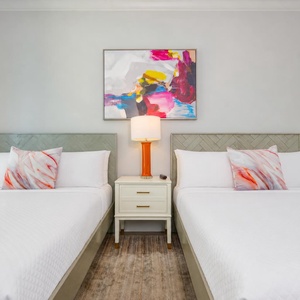 Relax on one of the cozy queen beds in this guest suite and enjoy a peaceful slumber