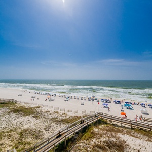 Breathe in the fresh coastal air from your balcony, watching beachgoers enjoy the sun and surf below